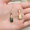 Conjunto Misto de 40 Pingentes de Joias Musicais com Gotejamento de Óleo Apresentando Guitarra, Violino, Piano e Pingentes Dourados para Acessórios de Chaveiro DIY