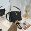 Bolso de mano con estampado de piedra, moda de lujo ligero, nuevo modelo 2026, bandolera de personalidad vintage, bolso pequeño tipo cubo de moda para mujer