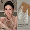 Sussurrando ao Vento Brincos de Pena Fresca com Contas Brincos Longos com Franjas Tacos Únicos e Bonitos Novo Estilo Chinês