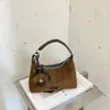 Bolsa de Axila Textura Fosca Retro Luxo Leve Feminina 2026 Novo Estilo Coreano para Trabalho Ombro Transversal Manual Bolsa Dumpling