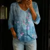 Nueva camisa estampada de cuello V abotonada de manga larga transfronteriza para mujer, elegante y con estilo para ir al trabajo, top casual único y moderno