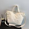 Bolso de mujer portátil de gran capacidad, primavera y verano 2024, nuevo bolso de tela de pana de estilo coreano, bolso bandolera informal sencillo.