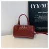 Bolsa de padrão trançado de alta qualidade para mulheres, nova bolsa tipo travesseiro vintage de nicho 2026, bolsa de ombro e transversal casual para o dia a dia de mulheres