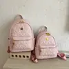 Nueva mochila con relieve en forma de corazón transfronteriza para estudiantes, bolsa ligera para viajes diarios, mochila pequeña de nicho de lujo ligero