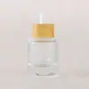 Nueva botella de vidrio gotero de lujo de bambú y madera de 30 ml con fondo grueso y punta gotera de goma engrosada, disponible en stock