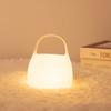 Lámpara de noche de silicona con forma de bolso, luz suave y colorida con múltiples cargas, protección para los ojos y adornos de valor de color.