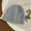 Chapéu de tricô liso estilo coreano com padrão circular, modelagem solta, quente e perfeito para outono e inverno. Tem um estilo descontraído, moderno e versátil, tornando-o um gorro simples e quente