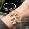 Pulsera de Borde de Perlas de Diamante Incrustado con Doble Flor de Venta Caliente Transfronteriza Europea y Americana Trébol Flor de Seis Pétalos Apertura Pulsera de Nicho Pulsera