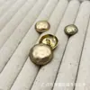 Botones metálicos irregulares tipo caparazón de tortuga para trajes, abrigos de punto de lana, botones decorativos simples y versátiles para coser a mano