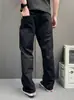 Estilo callejero, pantalones casuales negros estrellados para hombre, con un diseño único, corte recto hasta el suelo y un estilo workwear genial y moderno