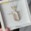 Nuevo colgante amuleto de paz de piedra ojo de gato, venta directa del fabricante, colgante de pan de artesanía de vidrio ojo de gato al por mayor