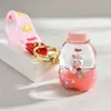 Lindo llavero de botella de arena movediza con gato KT, gatito de dibujos animados creativo, colgante para mochila escolar de estudiante, llavero para coche, baratijas