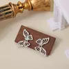 Brincos de Tarraxa Vazados de Borboleta com Zircônia Prateada para Mulheres Estilo Metal Retro Tendência Fashionable Temperamento Versátil Luxo Leve Brinco de Alta Qualidade