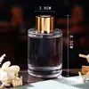 Botella de vidrio cilíndrica transparente simple para aromaterapia en stock con varillas de ratán y flores secas, botella de perfume tipo difusor, botella de aromaterapia portátil