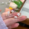 Brincos de Flor de Zircônia e Pérola com Design de Nicho, Brincos Exquisitos e Compactos para Mulheres, Novos Acessórios de Orelha Versáteis para o Início da Primavera de 2026