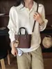 Bolsas pequeñas populares de comercio exterior para mujer 2026 nuevo bolso de moda versátil para hombro y cruzado, bolso de mano de cubo de alta calidad de moda