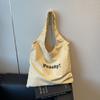 2025 Nuevo Estilo Coreano Rayado Gran Capacidad Letra Simple Versátil Bolsa de Tela Estampada Diseño Nicho Bolso de Hombro para Viajero