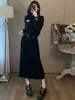 Elegante traje de falda de moda negro para mujer, nuevo estilo de otoño, conjunto elegante y adelgazante de sudadera y falda de dos piezas