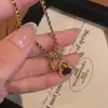 Collar de Calabaza con Piedra Ojo de Tigre y Circonita Bañado en Oro Real, Cadena para Clavícula Estilo Nicho de Lujo Ligero, Joyería Melard para Mujeres con un Toque de Alta Gama