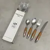 Herramientas Prácticas de Cocina para el Hogar Juego de Vajilla de Acero Inoxidable Mango con Veta de Madera Anti-quemaduras Cuchillo para Steak Occidental, Juego de Tenedor y Cuchara