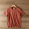 Modelo doméstico verano 2026 algodón lavado color sólido simple cuello redondo jersey camiseta de manga corta casual para hombre