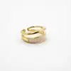 Anel de gota de óleo esmaltado empilhável de camada dupla para mulheres, com uma sensação em camadas, de nicho, fashion, cremosa, de luxo leve, versátil e de alta qualidade.