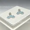Exquisito pendiente de botón para el cartílago de la oreja en forma de estrella de cinco puntas azul claro con circonita engastada en micro, simple, versátil, elegante, de nicho, dulce, lujo ligero