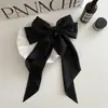Clip de resorte con lazo de perla, accesorio para el cabello de alta gama, elegante y francés para celebridades de Internet.