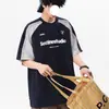 Camiseta de manga corta para hombre, estilo universitario moderno de verano 2026, con estampado de letras, color block de retazos retro de alta resistencia, para pareja