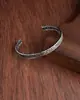 Pulseira de abertura transfronteiriça europeia e americana, pulseira de metal antiga de prata masculina e feminina, pulseira retrô simples de escultura de penas de bambu, atacado