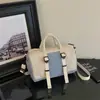 Bolso tipo Boston casual ligero de dos tonos 2026 nuevo versátil moda de invierno bandolera y de hombro