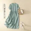 Foto Real de Vestido Camisero Casual Holgado de Manga Corta de Color Sólido de Algodón y Lino Estilo Nuevo Verano 2026 para Mujer, de Longitud Media