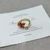 Otoño e Invierno Nuevo Anillo Retro de Zircón Rojo Hoja de Arce para Mujer Dulce Sentido de Alta Gama Exquisito Anillo Abierto Combinable