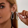 Accesorios de Moda Transfronterizos Europeos y Americanos, Elegantes Pendientes de Línea Geométrica en Forma de S, Pendientes de Botón Minimalistas Redondos Lisos de Aleación