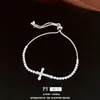 Pulsera de cordón con colgante de cruz de circonita, sensación de lujo ligero de alta gama, diseño de nicho a la moda, accesorio de mano único
