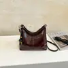 Nueva colección otoño/invierno 2026: Bolso de mano coreano simple, retro, moderno y versátil con un toque de alta gama, diseñado para mujeres, y se puede llevar como bandolera o bolso de hombro