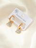 Aretes de acero de titanio de tendencia europea y americana con ojos de luna de flor, multiestilo, personalidad nicho femenina, aretes de acero inoxidable para mujer