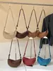 Bolsa feminina estilosa de alta qualidade Shuai Mi Jia, grande capacidade, nova bolsa transversal retrô de nicho outono 2026, bolsa de bolinho