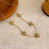 Pulsera y Collar de Acero de Titanio con Flor de Cuatro Hojas de Circonita Transfronterizo para Mujer 2025 Nuevo Lujo Accesible Diseño de Nicho Accesorios de Cadena para Clavícula