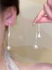 Clip para oreja de borla Super Hada Estrella para Mujer Aretes largos elegantes de lujo ligero ins nuevos nicho de celebridad de internet nuevos aretes combinan con todo