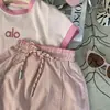 Ropa coreana para niños 2025 nuevo verano niñas combinación de colores letra camiseta de manga corta pantalones cortos rosas para niños conjunto de dos piezas moda