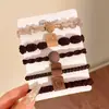 Diadema altamente elástica y duradera que no estrangula el cabello ni deja marcas, perfecta para asegurar coletas altas, accesorio versátil para el cabello de uso diario