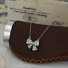 Cadena Clavicular Elegante para Mujer con Baño de Oro Real y Circonita Microincrustada, Collar Único con Diseño de Lazo, Exquisito Pulsera para el Día a Día