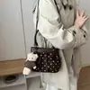 Outono 2026 Nova Elegante Nicho Fofa Estampa Simples Versátil Grande Capacidade Chique Bolsa de Ombro Bolsa Transversal Bolsa de Mão