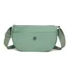 Bolso Bandolera Nuevo Verano 2026 Nuevo Ligero Color Sólido Tela de Nylon Bolso para Mamá Urbano Simple de un Solo Hombro para Mujer