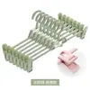 Almacenamiento para uso doméstico clips de plástico para pantalones sin marcas clips para faldas jk perchero multifuncional para pantalones clips para pantalones retráctiles colgador de pantalones de apilamiento multicapa