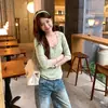 Foto real de um deslumbrante top de malha de lã com gola U e manga longa para mulheres, novo estilo do início do outono de 2026, top de roupa jovem 19691