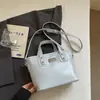 Bolso de mano pequeño de alta gama para mujer, nueva moda 2026, versátil, cruzado, casual, popular, de venta caliente, bolso cubo para ir al trabajo