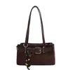 Bolso de Ante Estilo Retro Bajo el Brazo para Mujer 2026 Otoño Nuevo Lanzamiento Bolso Baguette de Diseño de Nicho Bolso de Hombro Único de Alta Gama Moderno
