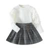 Top de manga abullonada a cuadros de cuello redondo para niños europeos y americanos de otoño e invierno Falda a cuadros Traje de estilo universitario para niñas en stock